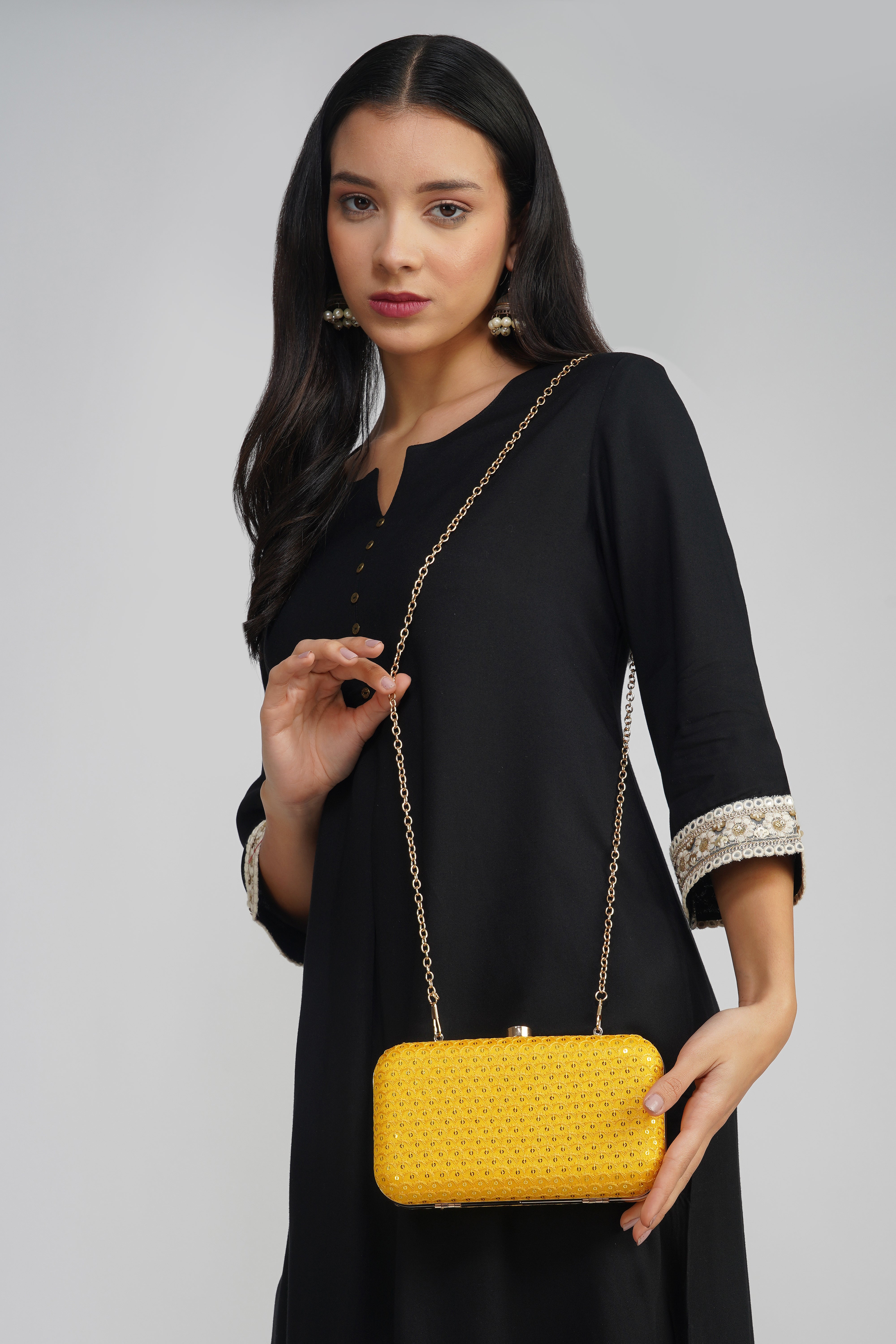 Nice-G Yellow Charm Clutch: Your Stylish Statement Piece